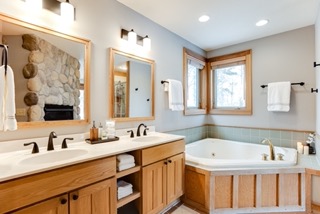 Master bathroom with large jetted tub and fireplace