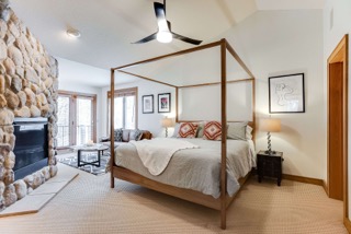 Master bedroom with jetted tub and fireplace